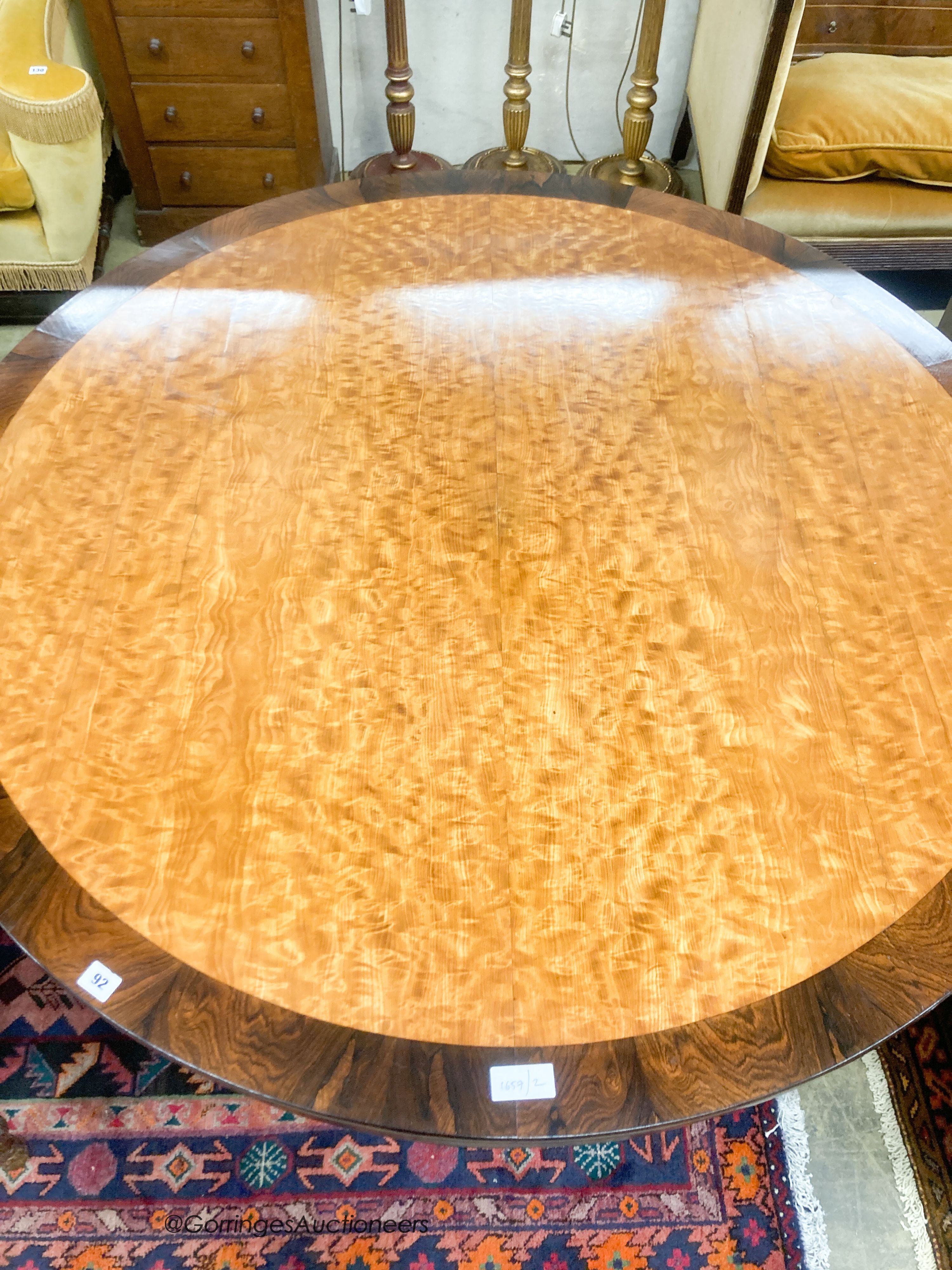 A George IV and later mahogany and satinwood circular tilt top breakfast table, diameter 138cm, height 76cm